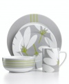 Stylized blooms and ticking stripes mix things up in the graphic Fan Floral place settings. A subdued gray, white and green palette softens the bold patterns in everyday porcelain from Echo Design.