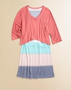It looks like a tee with a skirt but this easy, pretty style is actually one piece with a loose solid bodice attached to a slightly flared, widely striped skirt.V necklineThree-quarter sleevesTop has loose, contour hemSlight A-line shapePullover styling50% rayon/50% polyesterMachine washImported