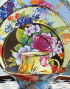 A vibrant bouquet of flowers blossoms on an enameled steel charger, hand decorated to create the ideal touch of color on a summertime table. From the Flower Market Collection Front and back design Bronzed stainless steel rim 12 diam. Dishwasher safe Imported 