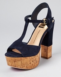 A glazed cork sole lends an unexpected touch to Dolce Vita's Baxter sandals, a T strap silhouette with girlish charm. A glazed cork sole lends an unexpected touch to Dolce Vita's Baxter sandals, a T strap silhouette with girlish charm.