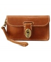 Get into a southwest groove with this exquisite Austin clutch from Fossil, featuring rich, unlined leather, classic key and lock closure and detail stitching. Slip it in your satchel or tote for a stylish way to stay organized.