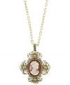 Perfectly paired. An elegant cameo and cross combination stands out on this distinctive vintage-style pendant necklace from 2028. Crafted in brass tone mixed metal. Approximate length: 16 inches + 3-inch extender. Approximate drop: 1-1/2 inches.