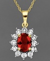 Regal and resplendent. An oval-cut ruby (1-1/8 ct. t.w.) and round-cut diamond accents adorn this royalty-inspired pendant. Crafted in 10k gold. Approximate length: 18 inches. Approximate drop: 5/8 inch.