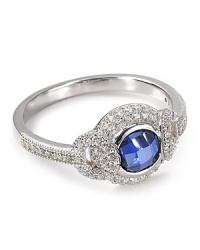 A dazzling sapphire stone illuminates a solid sterling silver band on this Crislu ring, surrounded by elegant cubic zirconia stones. A dazzling sapphire stone illuminates a solid sterling silver band on this Crislu ring, surrounded by elegant cubic zirconia stones.