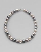 A soft melange of grey, nuage and white baroque man-made pearls creates drama at the neck. 14mm multicolor organic baroque pearls Length, about 20 Sterling silver spring clip clasp Made in Spain