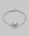 From the Love Britt Collection. Signature interlocking G in an iconic heart shape accents the wrist beautifully. Sterling silver Width of heart, about ¾ Length, about 6½ Lobster clasp closure Made in Italy 