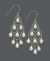 Pristine pearl drops add just the right amount of decoration. These chandelier-style earrings feature nine cultured freshwater pearls (6-6-1/2 mm) in a sophisticated sterling silver setting. Approximate drop: 2-1/4 inches.