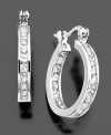 A classic way to lend sparkle to any outfit. These graceful hoop earrings by B. Brilliant feature round-cut cubic zirconia (2-1/3 ct. t.w.) along its length. Measures approximately 1/2 inches in diameter.