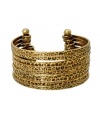 The perfect cuff for cocktail hour. Dress up your look in this chic, BCBGeneration style. Nine rows of antique gold tone mixed metal feature an intricate, textured surface and open cuff design that slips easily over the wrist. Approximate diameter: 1-1/2 inches.