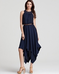 Topped with a macramé-detailed neckline, this Anne Klein Dress belted dress boasts a flouncy handkerchief hem for graceful movement. Topped with a macramé-detailed neckline, this Anne Klein Dress belted dress boasts a flouncy handkerchief hem for graceful movement.