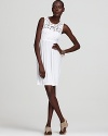 Nola Z's trend-right white dress softens summer style with luxe lace and an easy silhouette.