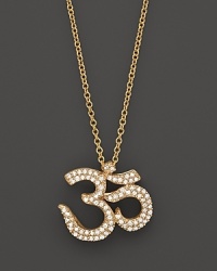Diamonds set in 14K yellow gold ohm pendant. Diamonds set in 14K yellow gold ohm pendant.