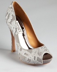In patterned, metallic silk, Badgley Mischka's dressed up Roxie pumps showcase a luxe look. In patterned, metallic silk, Badgley Mischka's dressed up Roxie pumps showcase a luxe look.