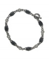 Brand new or one of your grandmother's cherished pieces? Only you'll know with this elegant bracelet by 2028. Faceted jet stones and round-cut crystals alternate for a modern take on old-fashioned sophistication. Set in hematite-plated mixed metal. Approximate diameter: 2-1/2 inches.