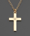 A lovely and meaningful gift, this 14k gold dainty cross pendant features a pretty diamond accent.