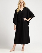 An elegant design with a gathered front and ruffled sides for comfortable, yet sophisticated look. V-neckThree-quarter length kimono sleevesGathered frontRuffled sidesPull-on styleAbout 50 from shoulder to waist67% polyester/33% rayonMachine washImported 