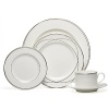 Vows tea saucers by Lauren Ralph Lauren Home. Inspired by graceful curves of wedding rings, this elegant dinnerware line features interconnected platinum bands on the finest bone china. Makes a stunning table for any special occasion.