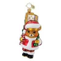 A bear takes on Santa's duties, toting toys and cheer to children in this Pediatric Cancer Awareness holiday ornament.