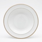 Rings of gold adorn fine white bone china with the lustrous shine of a wedding band. White bone china features two different border trims of gold, a wide corded border of textured grosgrain ribbon on some pieces, a narrow edge on others.