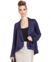 A back cutout and ruffled hem ups the fashion cred on this BCBGeneration jacket -- perfect for a fall layered look!