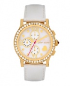 Never miss an opportunity to shine. Betsey Johnson doesn't on this watch crafted of a white leather strap and round gold tone stainless steel case. Bezel embellished with crystal accents. White mother-of-pearl chronograph dial features gold tone dot markers, Roman numerals, three subdials, heart at four o'clock, gold tone hour and minute hands, signature fuchsia second hand and logo. Quartz movement. Water resistant to 30 meters. Two-year limited warranty.