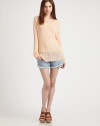 Dropped shoulders, long dolman sleeves and slight distressing add a dab of slouchy-chic to this lengthy, lightweight sweater. ScoopneckDropped shouldersLong dolman sleevesDistressed cuffs and hemLonger length hits below the hips95% rayon/5% spandexDry cleanMade in USAModel shown is 5'10 (177cm) wearing US size XS/S.