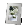 A scalloped border inspired by delicate lace lends classically feminine style to this silver-plated frame from Vera Wang.