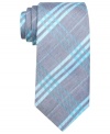 An energetic color palette lets this plaid tie from Ben Sherman wake up a charcoal gray world.