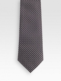 Patterned tie woven in fine Italian silk.About 3.1 wideSilkDry cleanMade in Italy