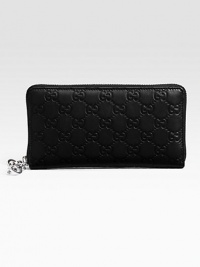 Zip around wallet with interlocking G detail in guccissima leather with leather trim/interior and nickel hardware.Zip around closure Twelve card slots Three bill compartments Zip coin pocket Fully lined 7W X 3½H X ½D Made in Italy