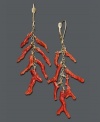 Bring new life to your wardrobe with underseas style! These fresh earrings feature bright coral branches suspended from a 14k gold chain and setting. Approximate drop: 2-1/2 inches.