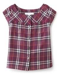 Burberry's picture-perfect summer shirt is rendered in a rich plaid, with engraved buttons and cap sleeves. Burberry's picture-perfect summer shirt is rendered in a rich plaid, with engraved buttons and cap sleeves.