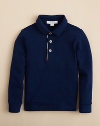 Updated with Burberry check trim at the polo placket and a piqué finish, this polo is a polished layering piece when the weather cools. Updated with Burberry check trim at the polo placket and a piqué finish, this polo is a polished layering piece when the weather cools.