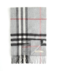 Burberry's oversized check adorns this luxe cashmere scarf. Burberry's oversized check adorns this luxe cashmere scarf.