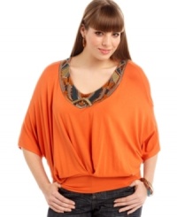 Get Carnival-inspired style with ING's dolman sleeve plus size top, accented by a beaded neckline. Get Carnival-inspired style with ING's dolman sleeve plus size top, accented by a beaded neckline.