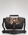 Sam Edelman lends a tough girl touch to this statement-making messenger bag with bold spikes, black leather, and a luxe leopard print.