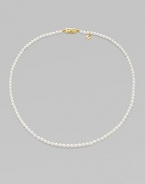 A single strand of luminous pearls with signature clasp closure.4mm white cultured pearls 18K yellow gold Length, about 16 Minuette clasp closure Imported 