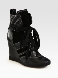 Pebbled leather and suede on an elevated wedge, with contrast stitching and wrap-around laces for a street-chic look. Leather-covered wedge, 4 (100mm)Leather and suede upperBack pull-tabLeather liningRubber solePadded insoleMade in ItalyOUR FIT MODEL RECOMMENDS ordering one size up as this style runs small. Pebbled leather and suede on an elevated wedge, with contrast stitching and wrap-around laces for a street-chic look. Leather-covered wedge, 4 (100mm)Leather and suede upperBack pull-tabLeather liningRubber solePadded insoleMade in ItalyOUR FIT MODEL RECOMMENDS ordering one size up as this style runs small.