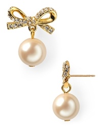 A pair of prim and proper pearls dangle oh-so delicately from crystal-bedecked posts on these kate spade new york stud earrings. A pair of prim and proper pearls dangle oh-so delicately from crystal-bedecked posts on these kate spade new york stud earrings.