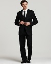 BOSS Black Pasolini Movie Suit. Two-button jacket with side vents. Four inner welt pockets, plus front flap and chest pockets. Boss Hugo Boss label sewn inside. Fully lined, with sleeve lining in rayon. Trousers are flat front, lined to knee with unfinished hem.