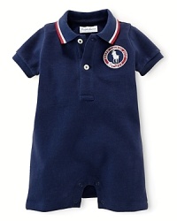 This preppy short-sleeved polo shortall in breathable stretch cotton mesh celebrates Team USA's participation in the 2012 Olympics with USA patching. This preppy short-sleeved polo shortall in breathable stretch cotton mesh celebrates Team USA's participation in the 2012 Olympics with USA patching.