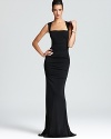 In a figure-flaunting silhouette, Nicole Miller's square neck dress shows off a curve-skimming fabric and an open back.
