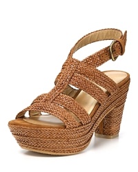 Waving weaves lend cultured style to Stuart Weitzman's Weaveit sandals, finished in a walkable heel balanced out by a thick platform. Waving weaves lend cultured style to Stuart Weitzman's Weaveit sandals, finished in a walkable heel balanced out by a thick platform.