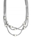 The look of loveliness. AK Anne Klein's chic, three-strand necklace showcases mesh details and imitation plastic pearls. Crafted in a imitation rhodium-tone mixed metal setting. Approximate length: 17-1/2 inches + 3-inch extender. Approximate drop: 1 inch.