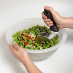 OXO salad chopper & bowl. This two-piece salad chopper set with durable bowl and rolling chopper hand tool has double stainless steel blades to efficiently slice greens, veggies and more. It has a generous angled, non-slip handle for comfortable chopping action. The bowl features a continuous curve for constant contact with blades.