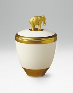 Exotic design in fine porcelain holds a scented candle inside and is topped with a gold-painted elephant. Handpainted 14k gold trim Pink Champagne scented candle Crafted with Limoges porcelain paste Beautifully gift boxed About 5H Made in Portugal