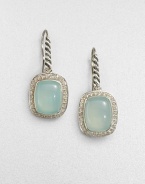 From the Noblesse Collection. A pretty aqua chalcedony cabochon center surrounded by a diamond accented border set in sleek sterling silver. Aqua chalcedonyDiamonds, .42 tcwSterling silverLength, about .39Hook backImported 