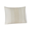A feminine pleated semi-sheer overlay adorning the silk shell of this HUGO BOSS decorative pillow adds an air of intricate luxury to your decor.