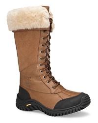 Stomp through snow drifts--stylishly. UGG® Australia's tall leather lace-ups feature a cozy-cool shearling lining. Stomp through snow drifts--stylishly. UGG® Australia's tall leather lace-ups feature a cozy-cool shearling lining.