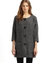 A simple collarless shape in a luxurious wool blend, with dolman sleeves and rustic wooden buttons.Round neckline Seamed yoke, front and back ¾ kimono sleeves Button front Dual patch pockets at front Fully lined About 33 from shoulder to hem 78% wool/18% polyester/4% other fibers Dry clean Made in USA